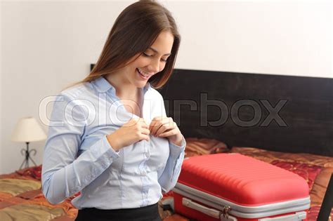 Businesswoman Traveler Undressing In A Hotel Room After A Business