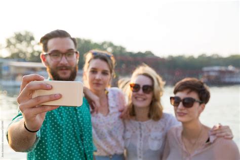 Group Of Young Hipster Friends Make Selfie Photo With Smartphone Camera By Stocksy Contributor