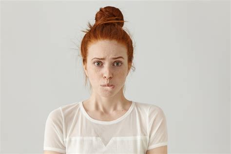 Free Photo Fearful Young Caucasian Female With Ginger Hair Dressed In White Blouse Having
