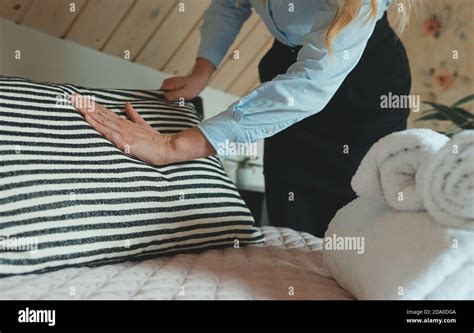 Room Service Woman Making Bed In Hotel Room Stock Photo Alamy