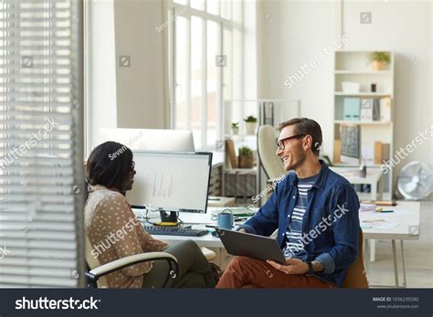 Smiling Project Manager Talking Employee Office Stock Photo 1936235590