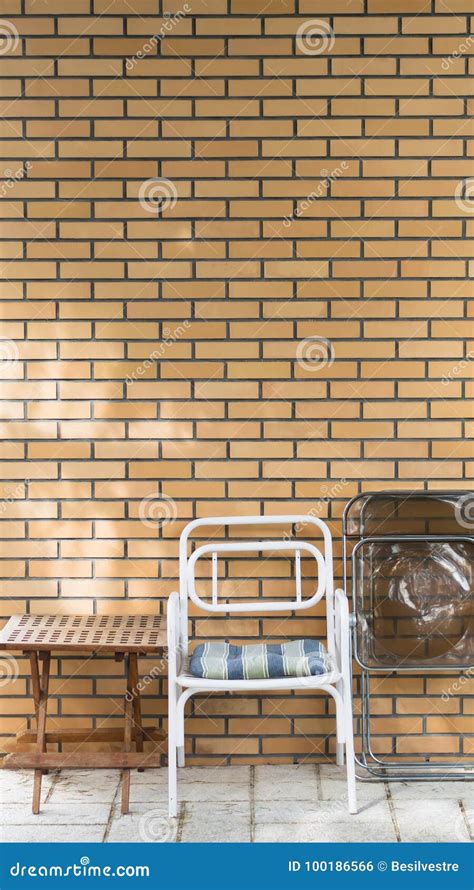 Chairs And Table In Front Of A Brick Wall Stock Photo Image Of