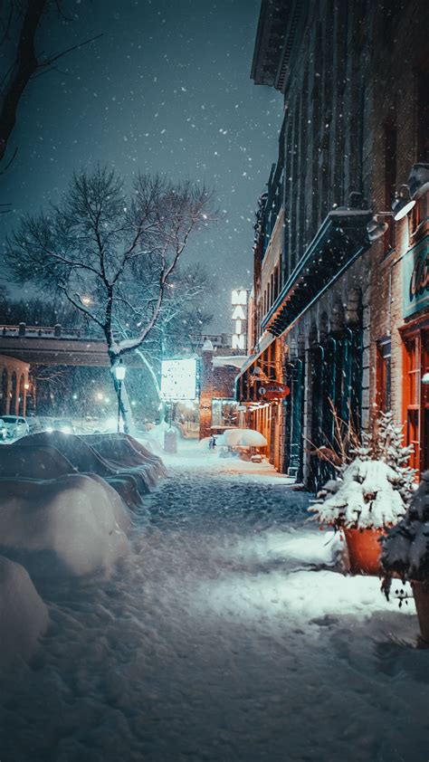 Download Wallpaper 2160x3840 City Evening Snowfall Winter Street