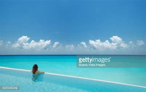 Woman In Infinity Pool Watching Open Sea Pool Watch Infinity Pool Pool