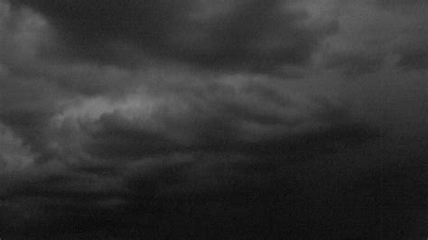 Download A Black And White Photo Of A Stormy Sky Wallpaper