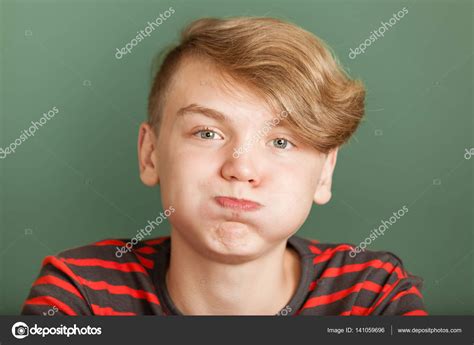 Boy Puffing Cheeks Stock Photo By ©jhandersen 141059696