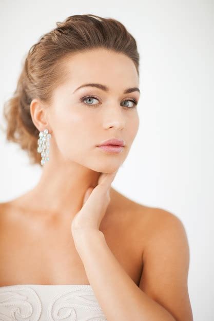 Premium Photo Close Up Of Beautiful Woman Wearing Shiny Diamond Earrings