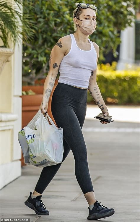 Unleashed And Fearless Miley Cyrus Rocks A White Tank Top On Her Trip To A Calabasas Drug Store