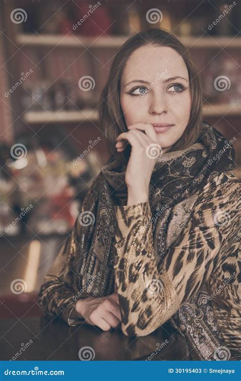 A Young Beautiful Girl Waiting For A Cup Of Tea In A Cafe Stock Image