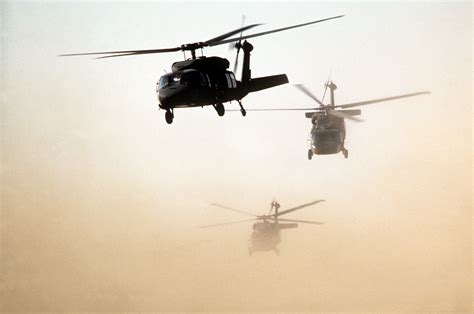 Us Army Uh 60 Black Hawk Helicopters Fly An Air Assault Training
