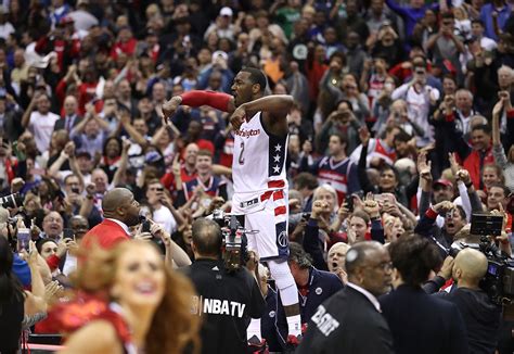 7 Glorious Photos Of John Wall Jumping On Scorers Table And