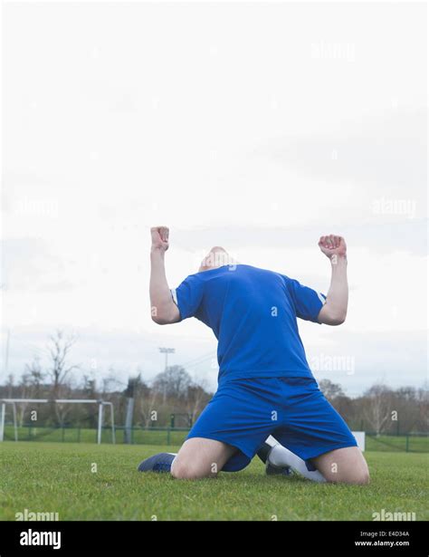 Football Player In Blue Celebrating A Victory Stock Photo Alamy