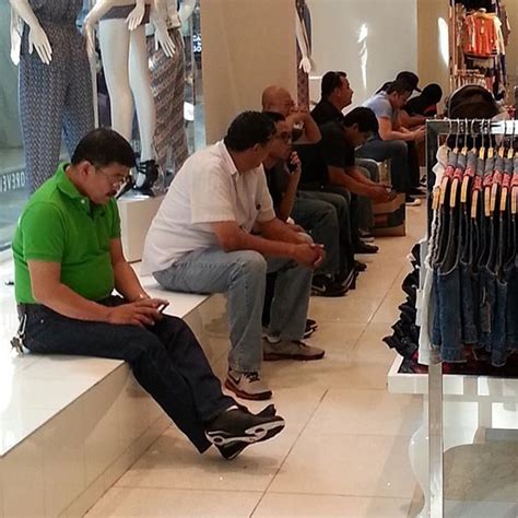 Guys Waiting For Wives To Shop