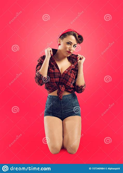 Pretty Pin Up Girl Posing With Hairstyle 50s Stock Photo