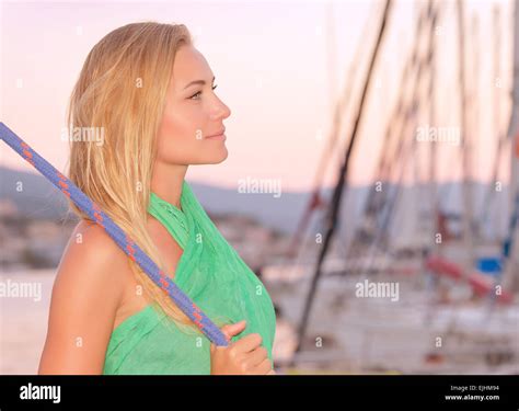 Portrait Of Beautiful Woman Relaxing On The Sail Boat Enjoying Warm