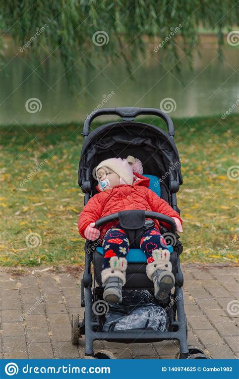 The Little Baby Is Sitting In The Pram Stock Image Image Of Office