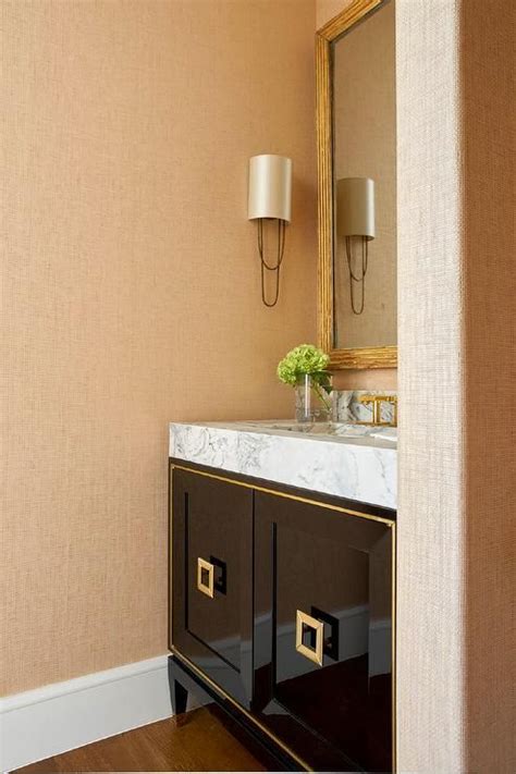 Gold Grasscloth Wallpaper Covers The Walls Of This Stunning Bathroom