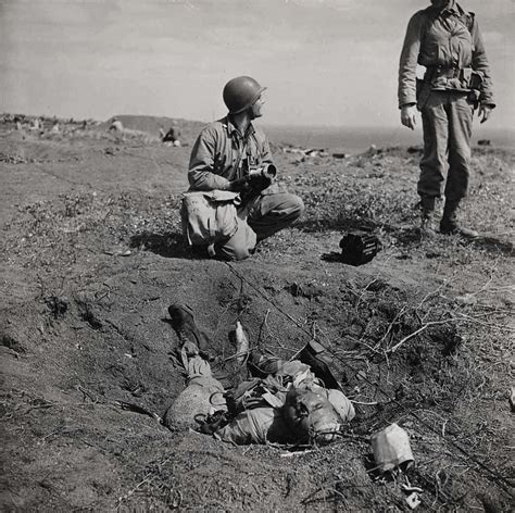 American Troops Near Dead Soldier In Mortar Hole During Battle Against