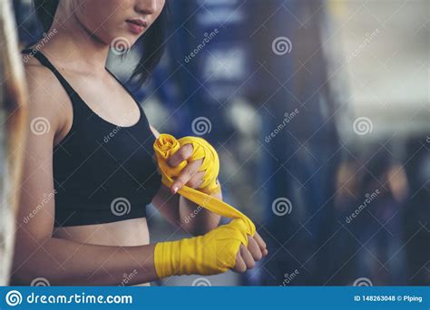 Fit Female Strap On Her Wrist And Exercise Hard To Strengthen Muscle