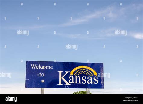 Kansas Welcome Sign At The Border Between Kansas And Missouri Stock