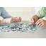 Senior Couple Doing A Jigsaw Puzzle Photograph By Science Photo Library