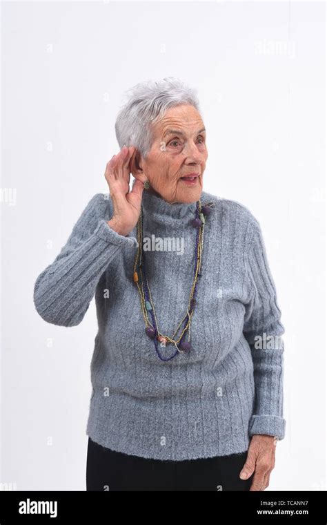 Senior Woman Putting A Hand On Her Ear Because She Can Not Hear On