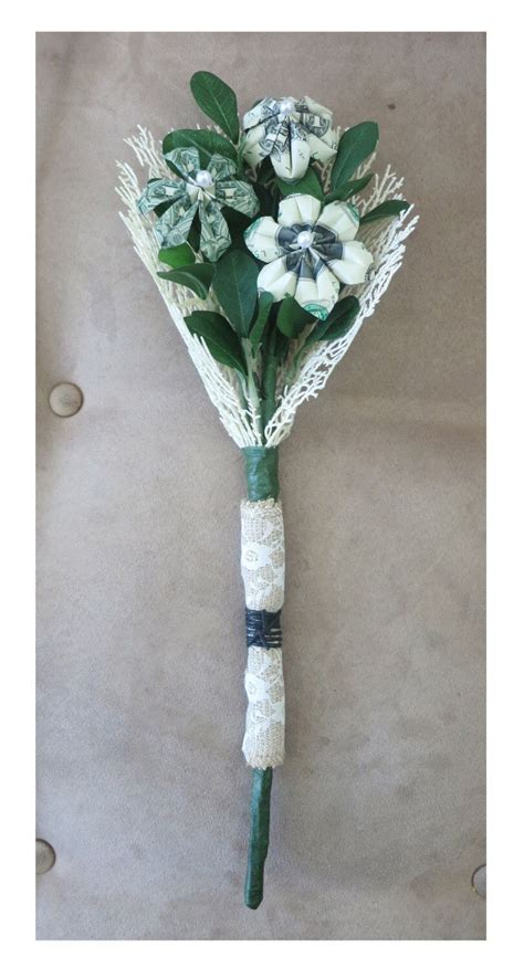 Dollar bill origami flowers are a fun alternative to giving a bouquet of fresh flowers for a special occasion like a birthday or graduation. Money bouquet (one dollar bills) - perfect for your special event! | Money bouquet, Money ...