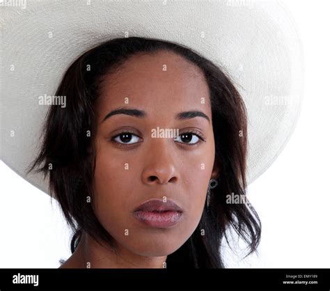 Serious Looking African American Woman Wearing A White Cowboy Hat Stock