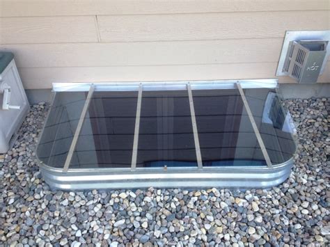 You will find this kind of a well cover very strong. Polycarbonate Window Well Covers - Crystal Clear