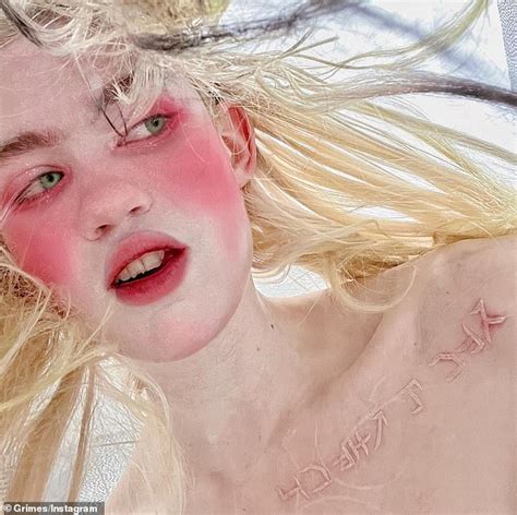 Elon Musk S Ex Girlfriend Grimes Reveals Latest Alien Scar Tattoo On