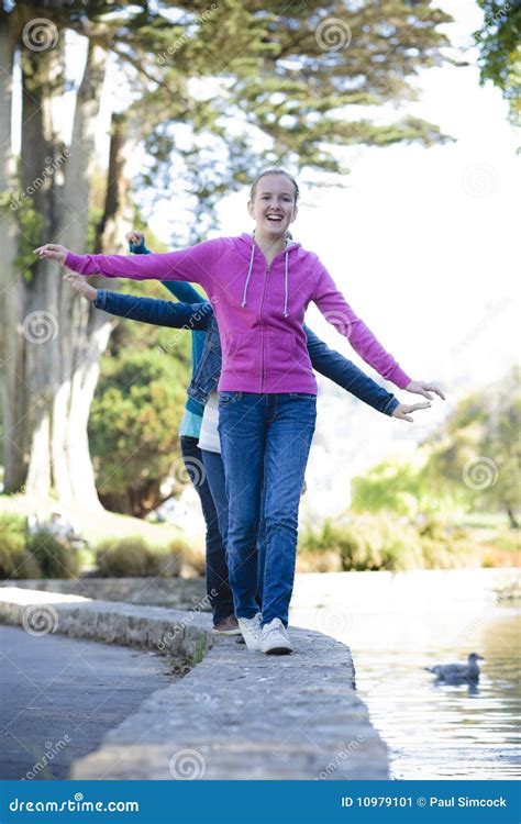 Tween Girls Walking Along A Pond Stock Image Image Of Outside