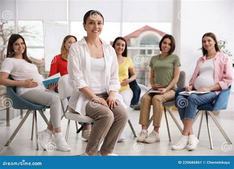Group Of Pregnant Women With Midwife At Courses For Expectant Mothers Stock Image Image Of