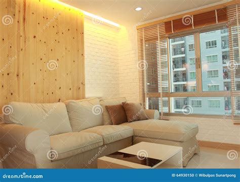Living Room With Light Wood Panel And Hidden Lighting Stock Photo