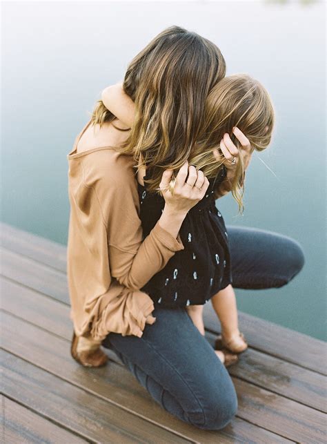 mother and daughter embracing by stocksy contributor ali harper stocksy
