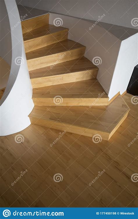 Vertical Shot Of A Curved Wooden Stairs Stock Photo Image Of Home