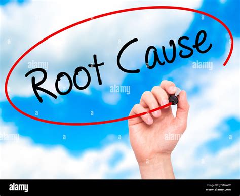Man Hand Writing Root Cause With Black Marker On Visual Screen