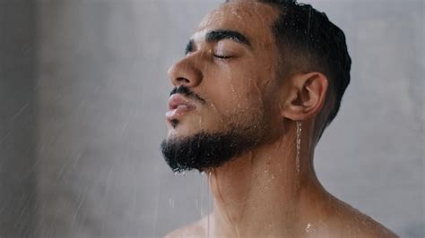 Premium Photo Arab Indian Hispanic Relaxed Man Bearded Guy Naked Male Washes Head Hair Face