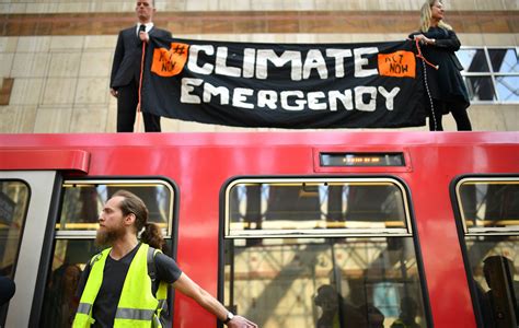 Extinction Rebellion Demonstrators Glue Themselves To Dlr Train As Protest Escalates