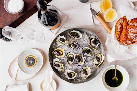 Champagne Poached Oysters With Caviar And Chive Oil