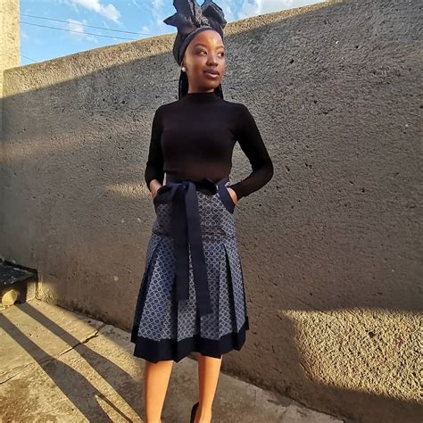 clipkulture tswana lady in beautiful a line shweshwe skirt with pockets and black top south