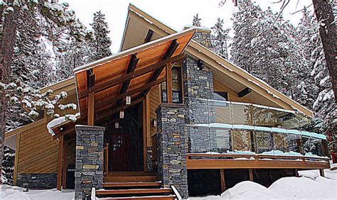 A Modern Mountain Alpine Home Design That Includes A Steep Sloped Roof