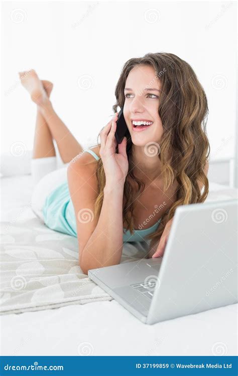 Cheerful Woman Using Mobile Phone And Laptop In Bed Stock Image Image Of Commu Domestic 37199859