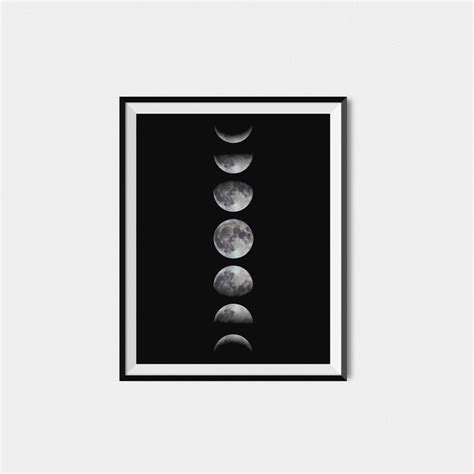 A Black And White Photo With The Phases Of The Moon In Its Frame