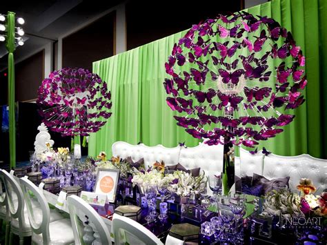 In many cultures, butterflies symbolize new life or change. Butterfly Centerpieces by JoseDesigns.com: BizBash Expo ...