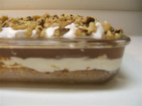 Chocolate pudding, whipping cream, pistachio pudding, strawberry preserves, coconut flakes, cheese colored chocolate, maraschino cherries. Four Layer Delight | Flickr - Photo Sharing!