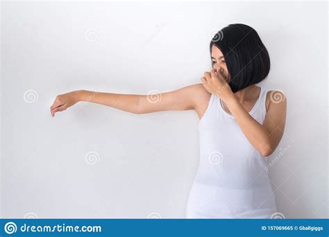 Asian Woman With Odor Sweatingfemale Smelling Or Sniffing Her Armpit