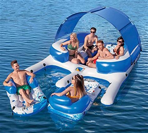 a group of people floating on top of an inflatable boat