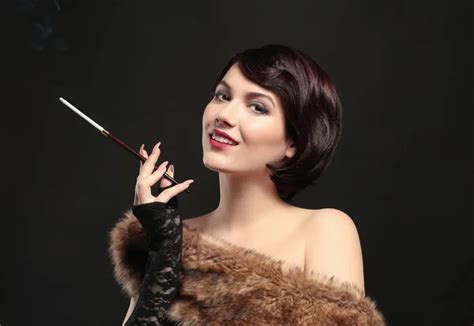 Woman Smoking With Cigarette Holder Stock Photo By ©belchonock 148525121