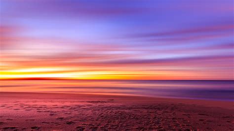 2560x1440 Purple Sky Beach Sunset Sand Footprints 1440p Resolution Hd