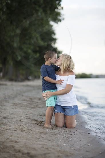 A Mom And Her Son Giving Her A Kiss On The Beach By Kristen Bruley